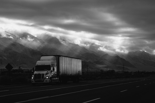 Semi truck with cloudy sky