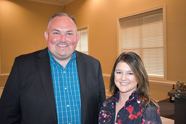 Cliff Riner with G&R Farms and Chelsea Blaxton with the Vidalia Onion Committee catch up during the annual meeting.