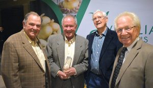 Four members of the Vidalia Onion Hall of Fame gather at the banquet. Pictured from left are R.T. Stanley Jr., Roy Kreizenbeck, Buck Shuman and Bob Stafford.