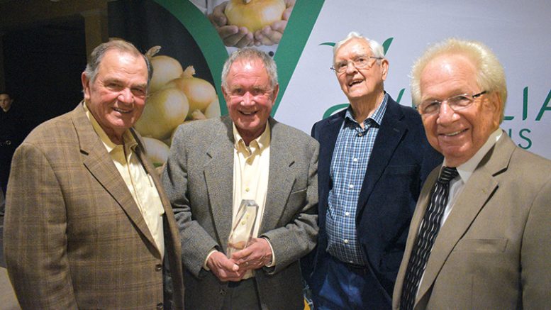 Four members of the Vidalia Onion Hall of Fame gather at the banquet. Pictured from left are R.T. Stanley Jr., Roy Kreizenbeck, Buck Shuman and Bob Stafford.