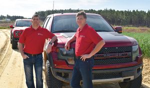 McLain family with trucks
