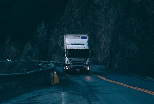 Semi truck on dark curvy road