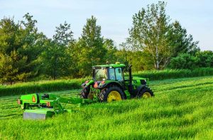 John Deere 6M Series Tractor in field