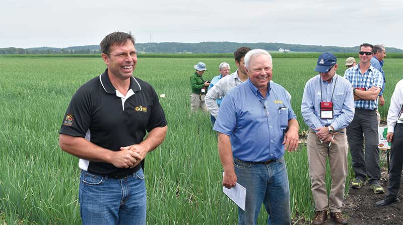 Rod and Richard Gumz share a laugh with visitors at their farm during the NOA field day.