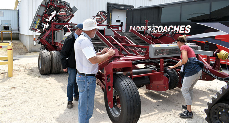 Attendees at the NOA field day check out Gumz Farms’ new Univerco onion harvester.