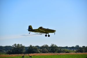 Airplane spraying crops