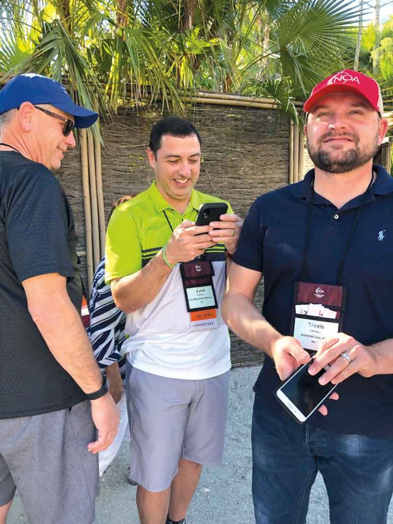 From left, Randy Clark with Volm, Jared Gutierrez with Columbia Basin Onion and Travis Whitney with Nunhems USA enjoy the balmy weather at the NGALA Wildlife Preserve.