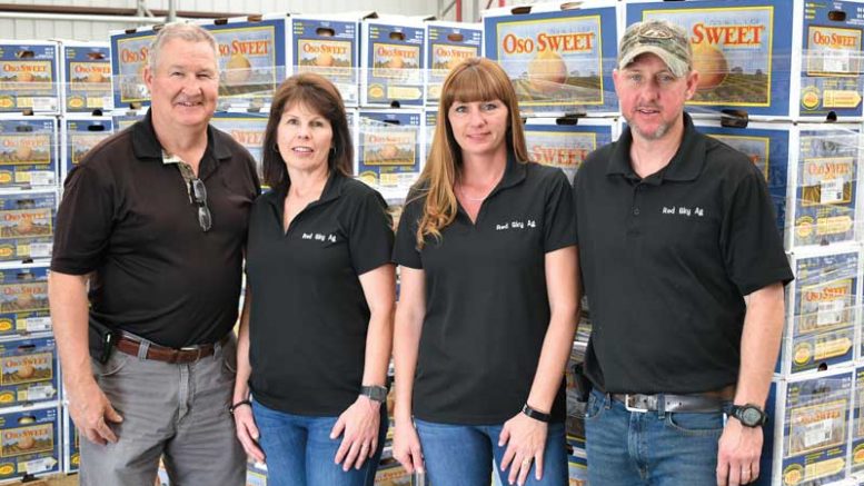 Pictured from left are Michael Hively, Cindy Hively, Heather Kinlaw and Steven Kinlaw. The Hivelys and Kinlaws operate Red Sky Ag.
