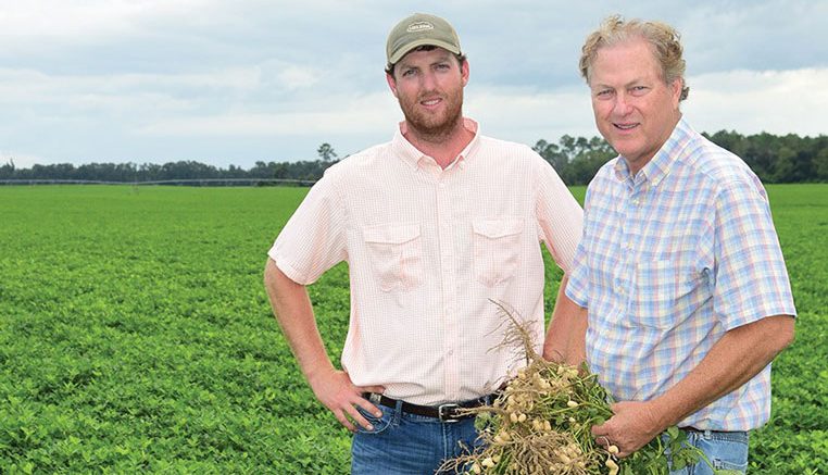 Parker Heard (left) will one day take over the family farm in Brinson, Georgia, from his father, Glenn Heard (right).