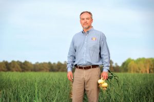 John Shuman in a field