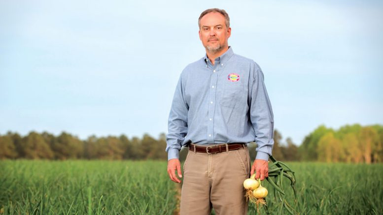 John Shuman in a field