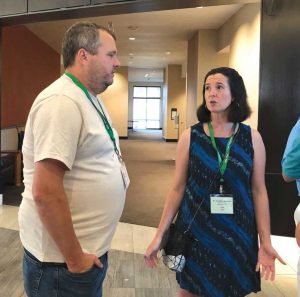National Onion Association (NOA) President Doug Bulgrin speaks with Jennifer McIntyre of the United Fresh Produce Association at the NOA’s summer convention in Nashville, Tenn., in July. McIntyre has urged the NOA to update its best practices document in the wake of food safety issues.